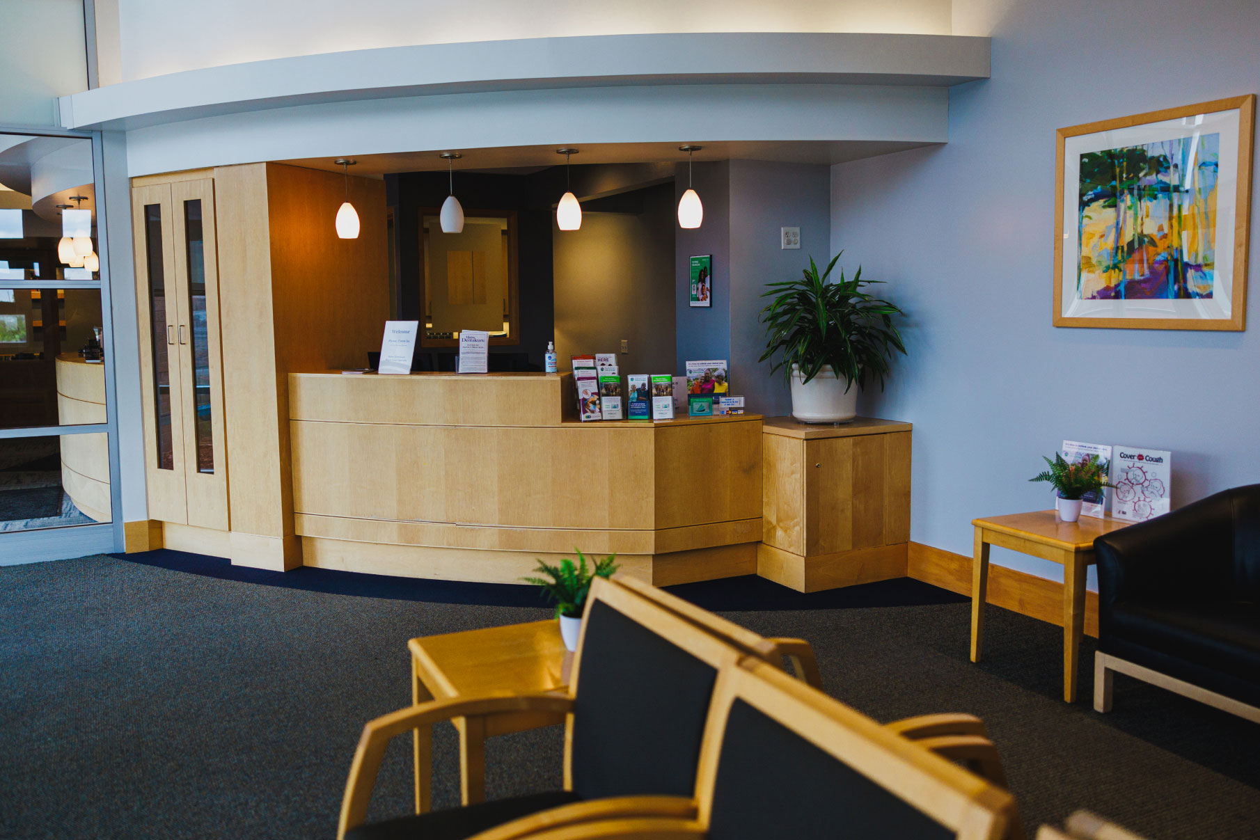 front desk area with blue walls and wooden accents